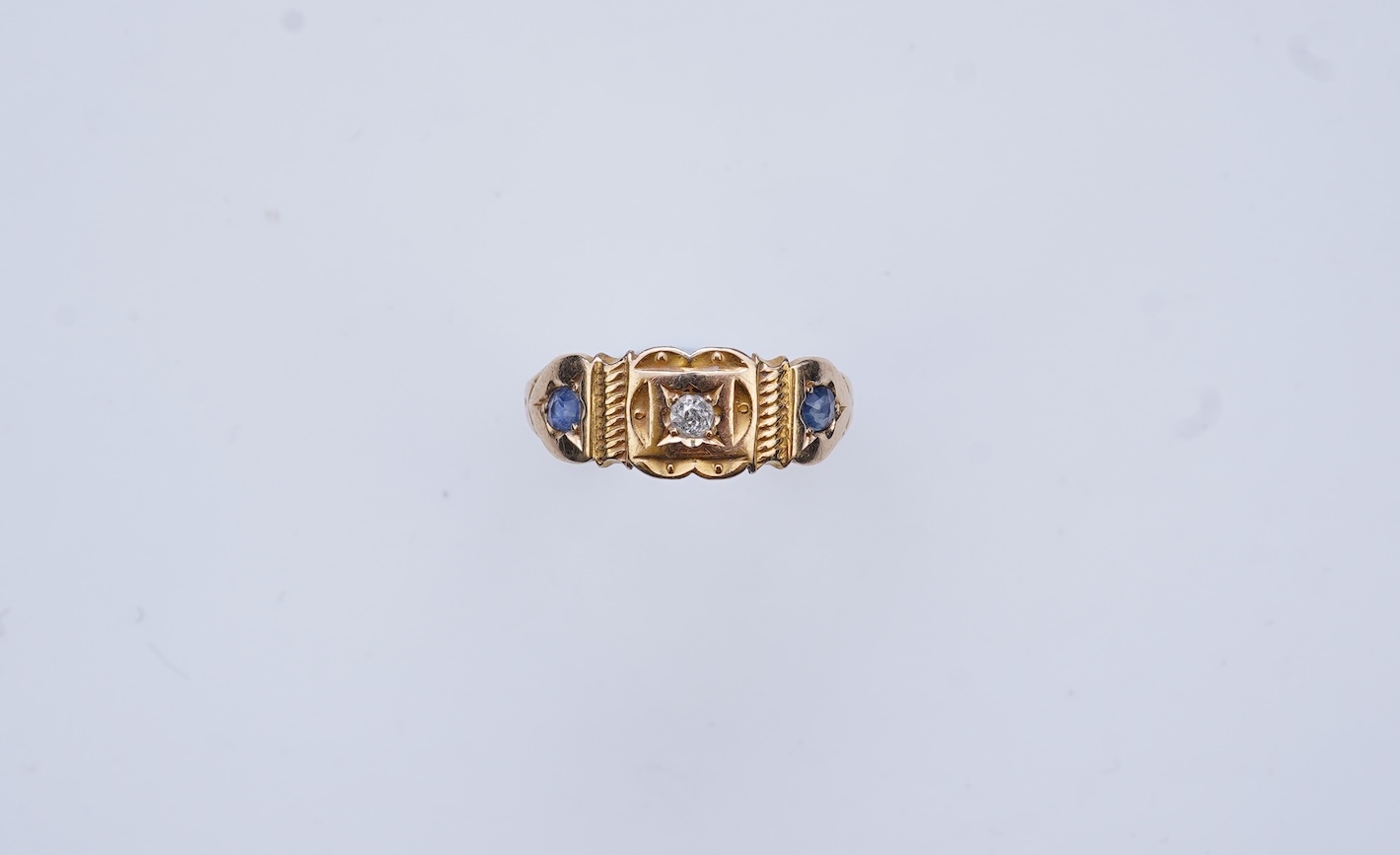 A Victorian sapphire and diamond three-stone ring, circa 1892
